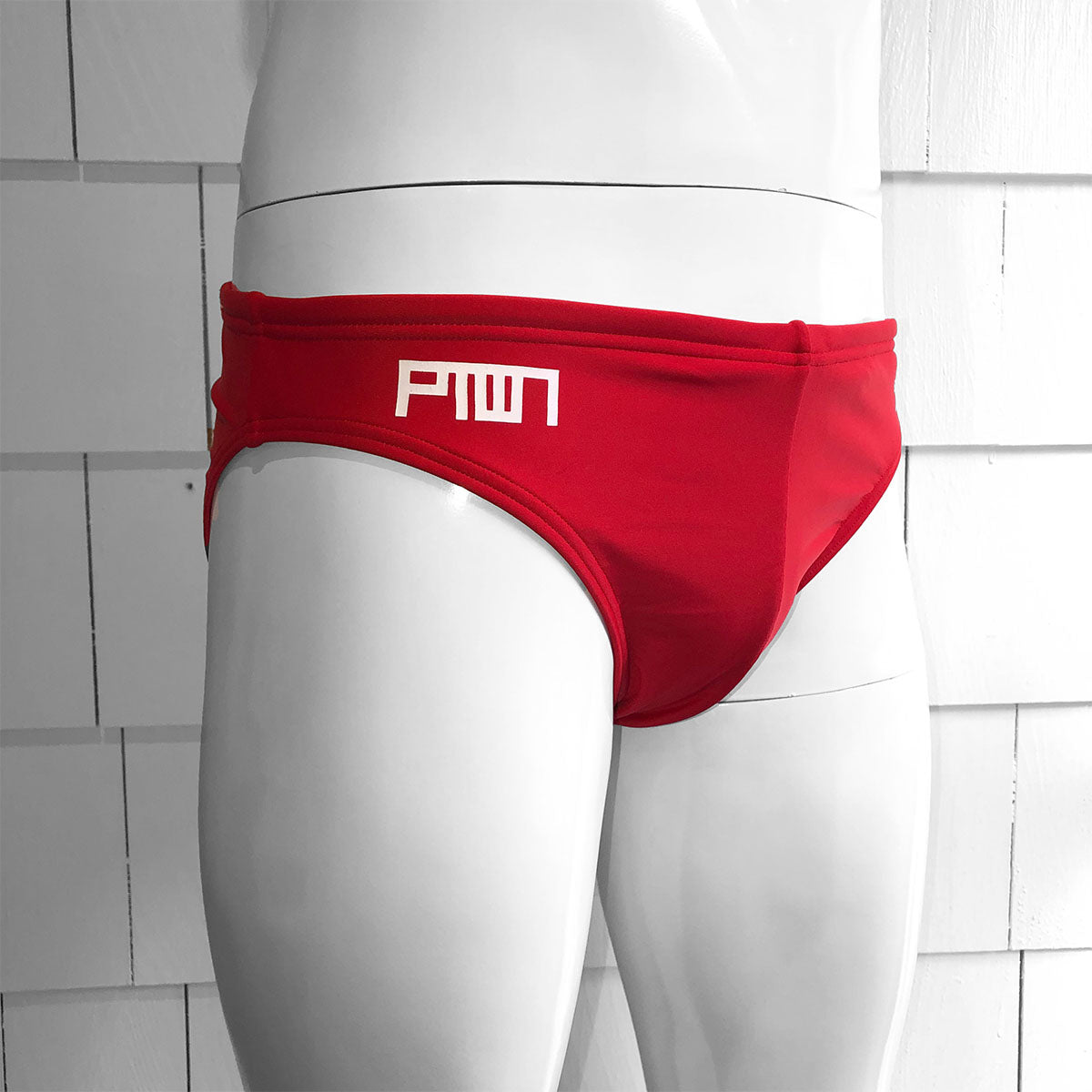 A red Speedo brief on a mannequin, featuring the TIM-SCAPES PTOWN logo and a 1-inch waistband.